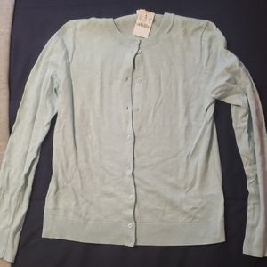 Light Blue Buttom Down Sweater. Never worn